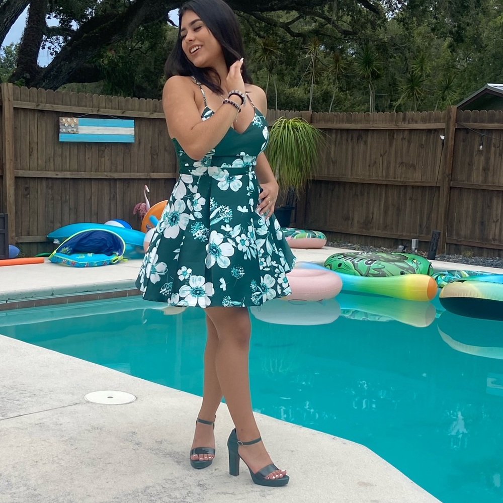 Green medium sized outgoing green dress. Only worn once for this picture.